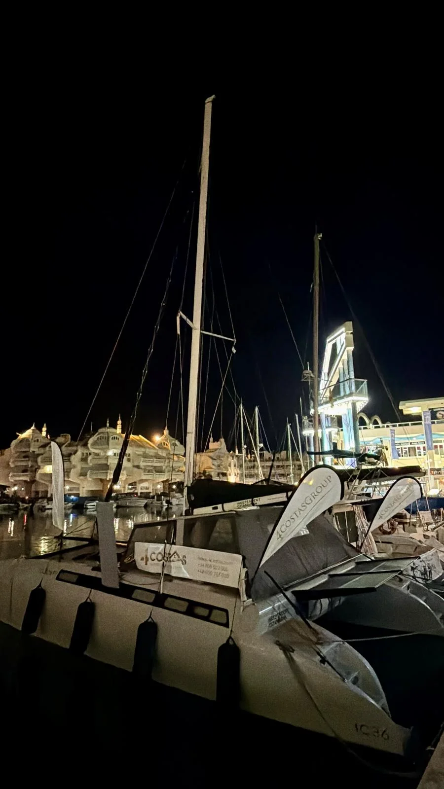 4 Costas Group yacht in a marina at night